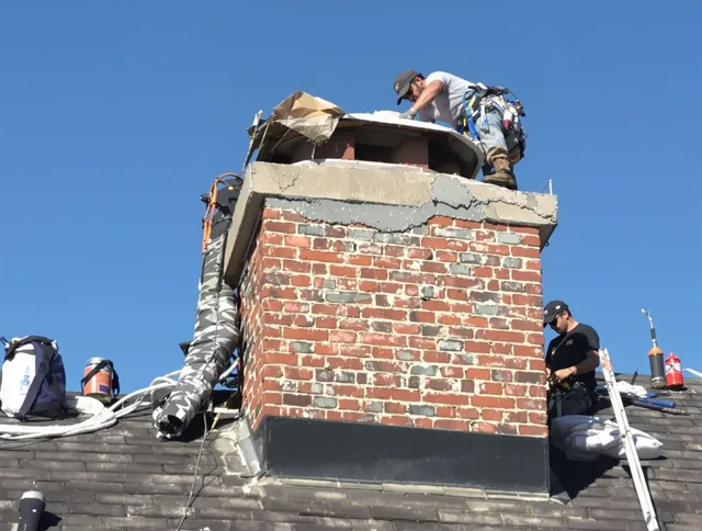Savannah Chimney Sweep installing a custom chimney crown in Savannah, GA