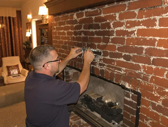 Savannah Chimney Sweep expert fixing a fireplace in Savannah, GA